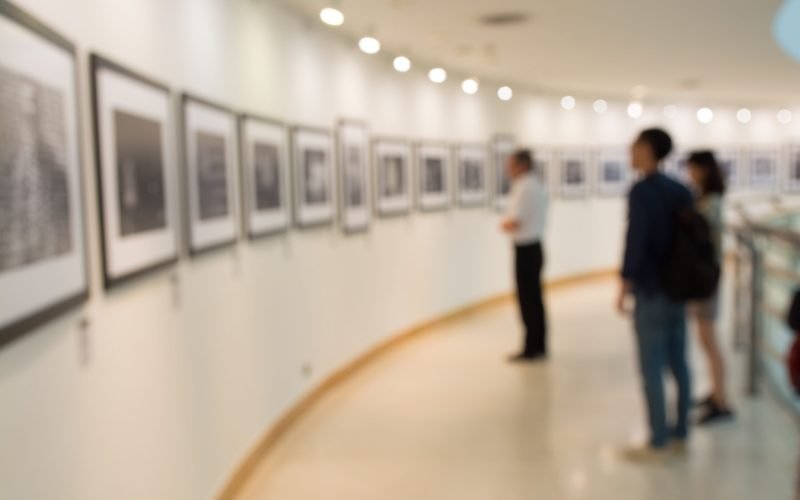 People Watching Photograph or Image in Art Gallery Museum, Abstract Blur or Defocus Background