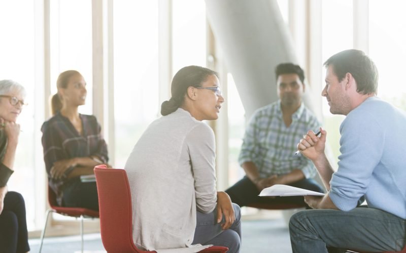 Business people discussing paperwork in meeting